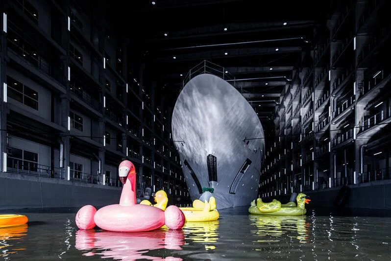 a statue of a bird on a floating object in a body of water aboard LEVIATHAN Yacht for Sale