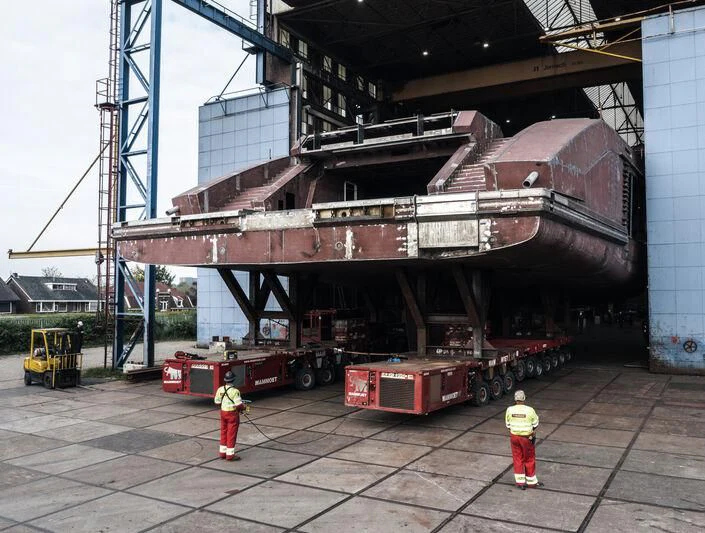 a large machine with a few people standing around it aboard LEVIATHAN Yacht for Sale