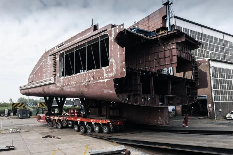 a large building with a red and black trailer aboard LEVIATHAN Yacht for Sale