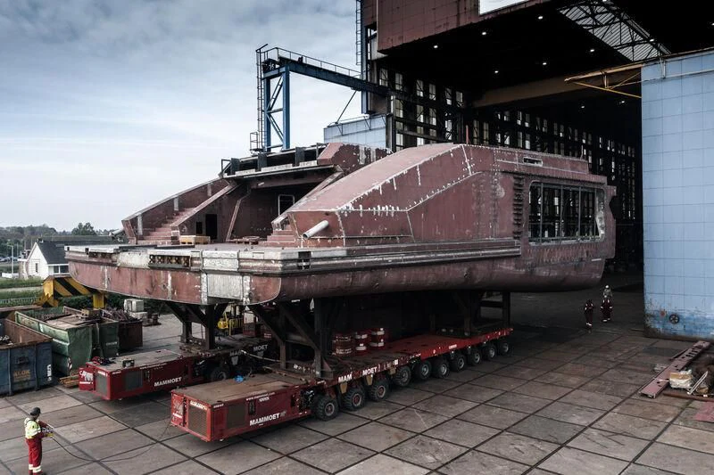 a large metal structure with a red roof and a crane aboard LEVIATHAN Yacht for Sale