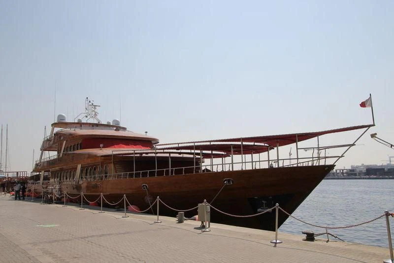 a large boat on a beach aboard TOUCH WOOD II Yacht for Sale