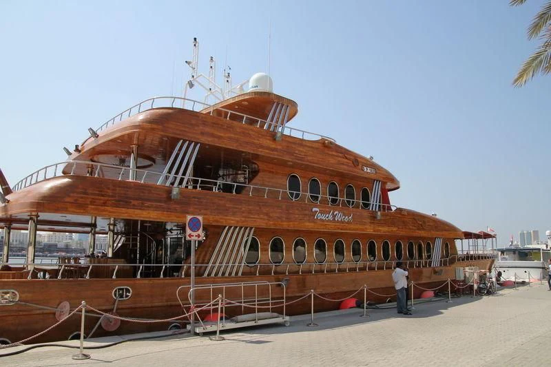 a large boat on a beach aboard TOUCH WOOD II Yacht for Sale