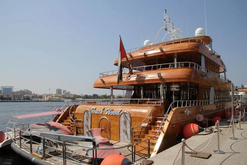 a boat docked at a pier aboard TOUCH WOOD II Yacht for Sale