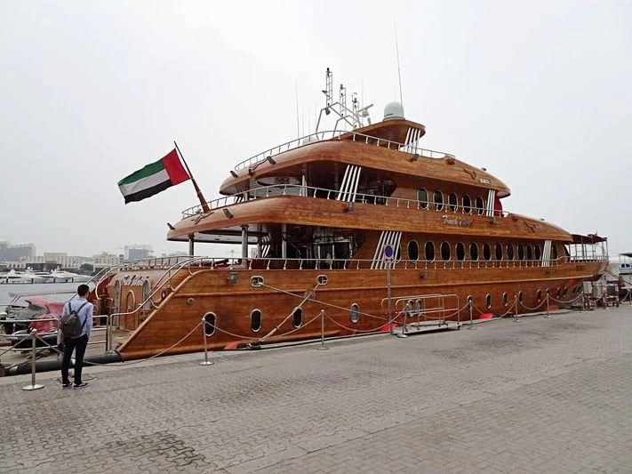 a large boat on a beach aboard TOUCH WOOD II Yacht for Sale