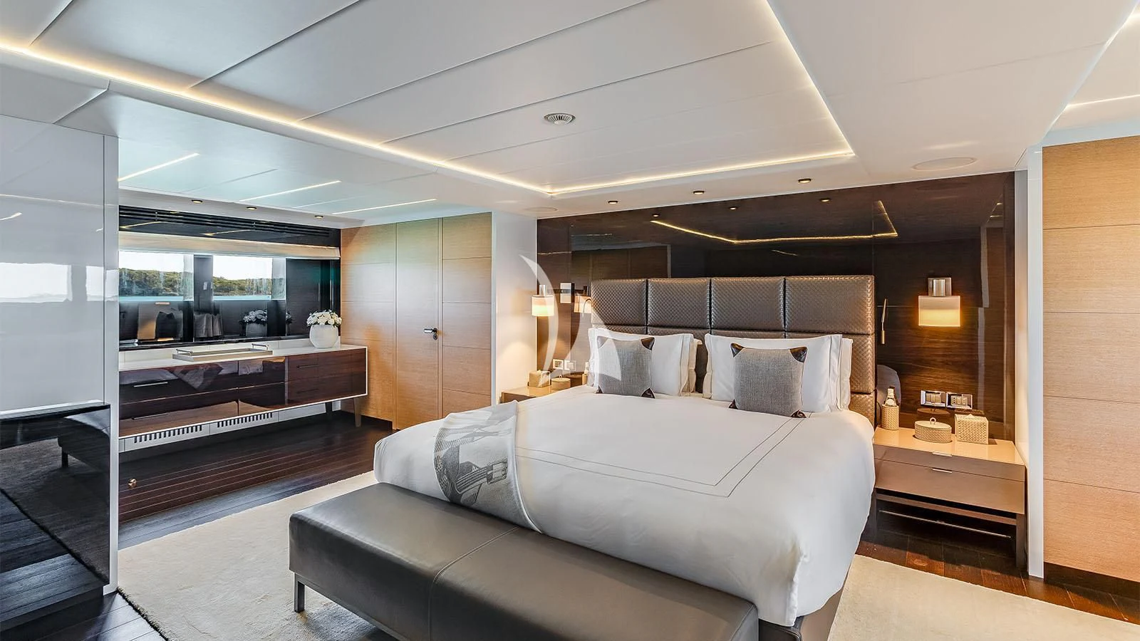 a bedroom with a bed and a piano aboard BON VIVANT Yacht for Sale