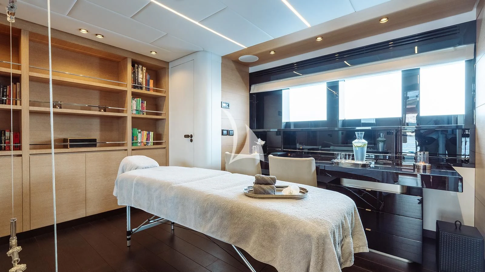 a room with a bed and a desk aboard BON VIVANT Yacht for Sale