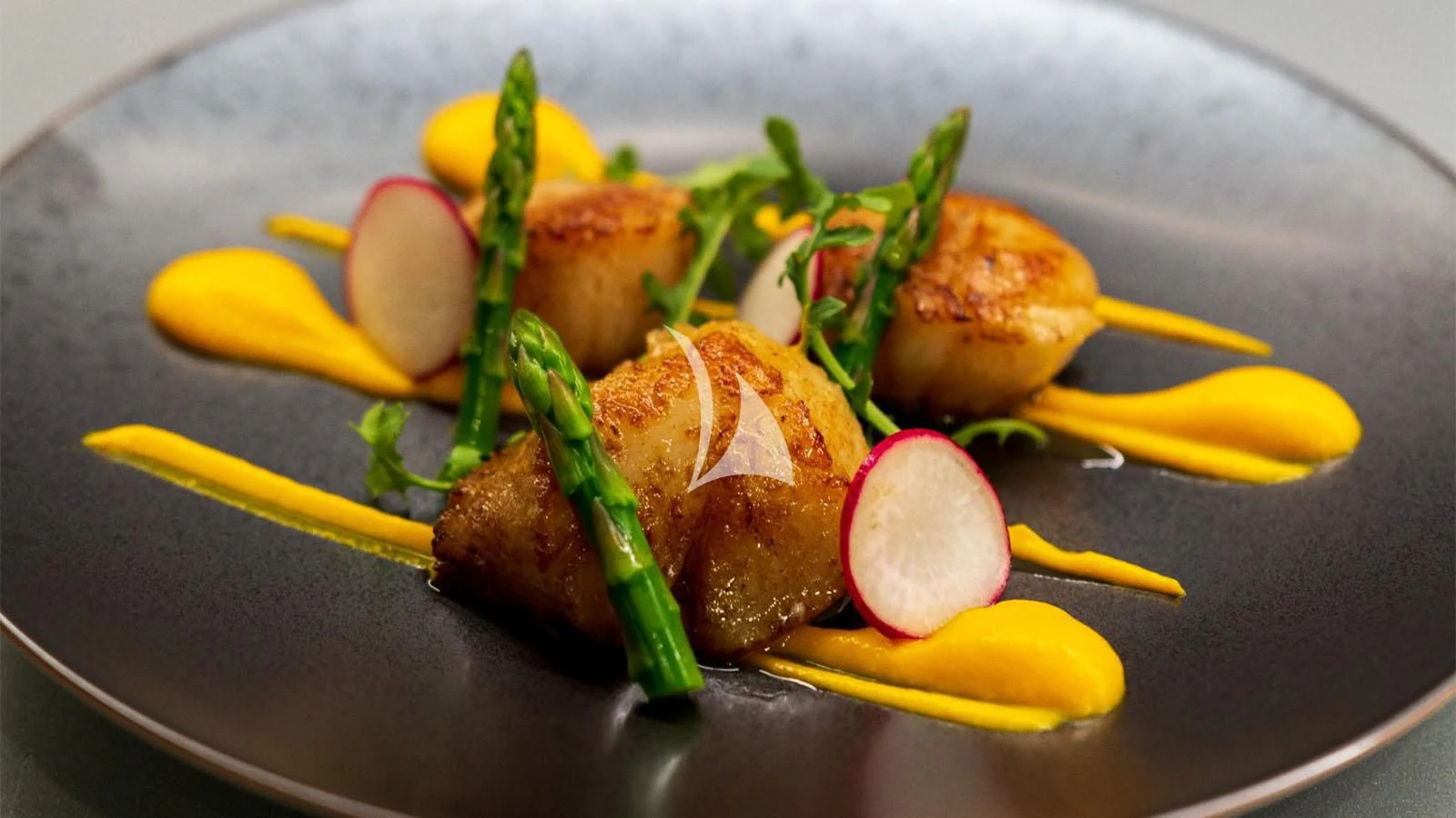 a plate of food aboard BON VIVANT Yacht for Sale