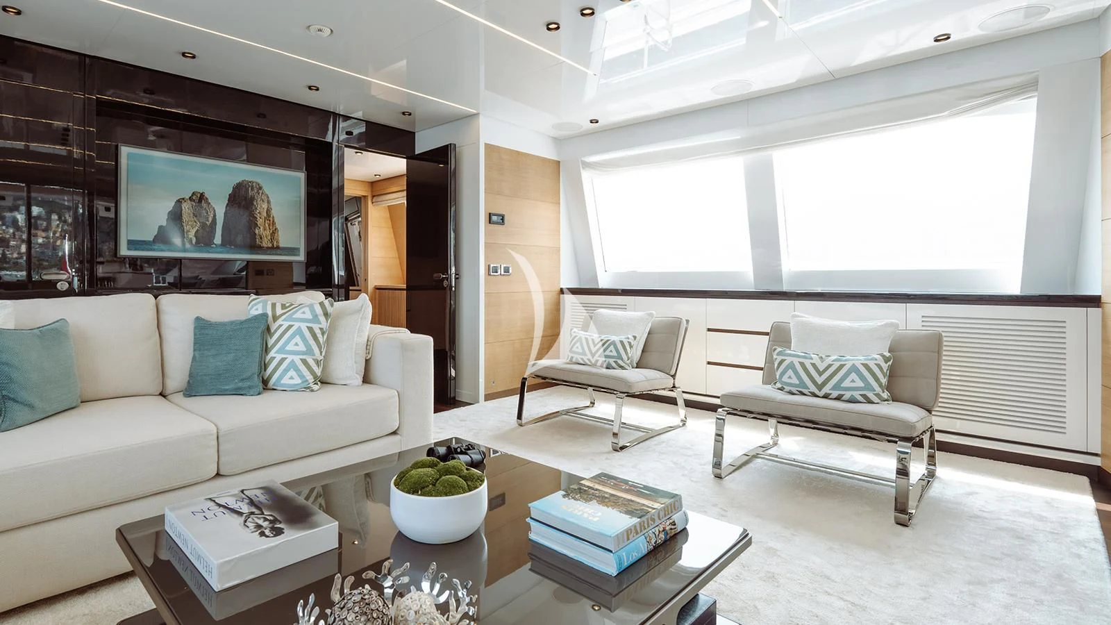 a living room with a couch and a television aboard BON VIVANT Yacht for Sale