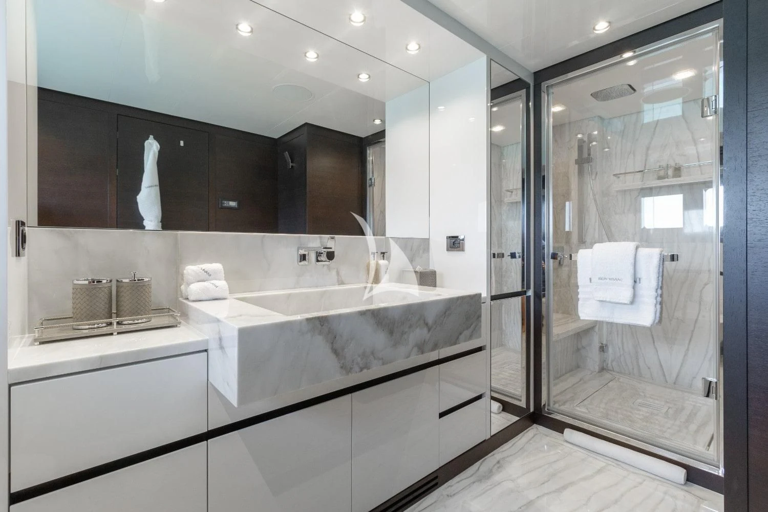 a bathroom with a glass shower aboard BON VIVANT Yacht for Sale