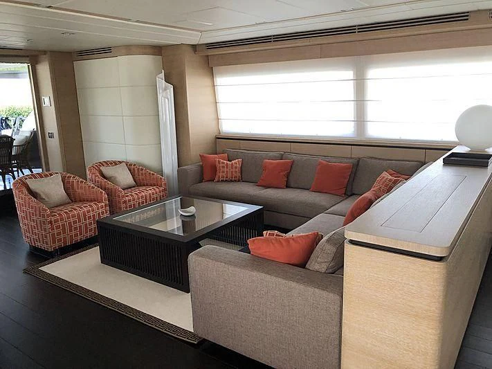 a living room with a couch and a coffee table aboard BON VIVANT Yacht for Sale