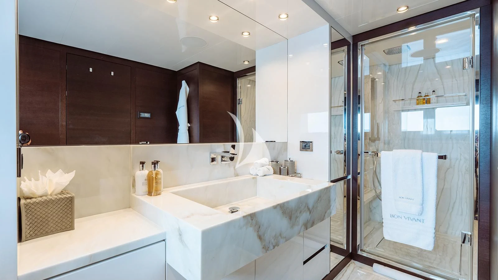 a bathroom with a large mirror aboard BON VIVANT Yacht for Sale