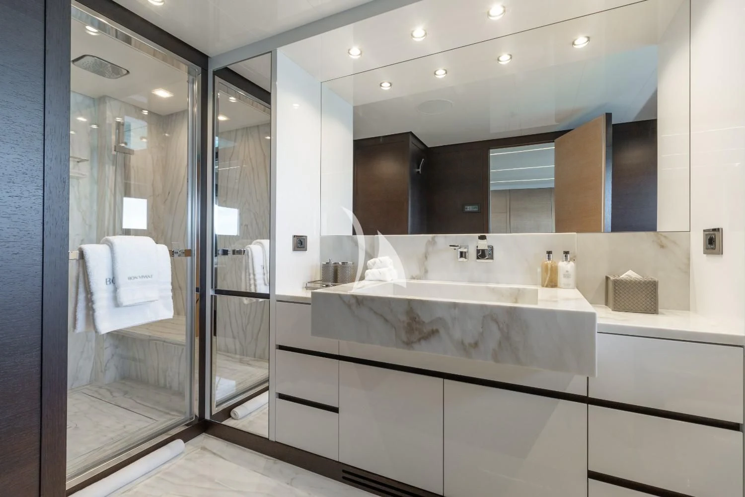 a bathroom with a large mirror aboard BON VIVANT Yacht for Sale