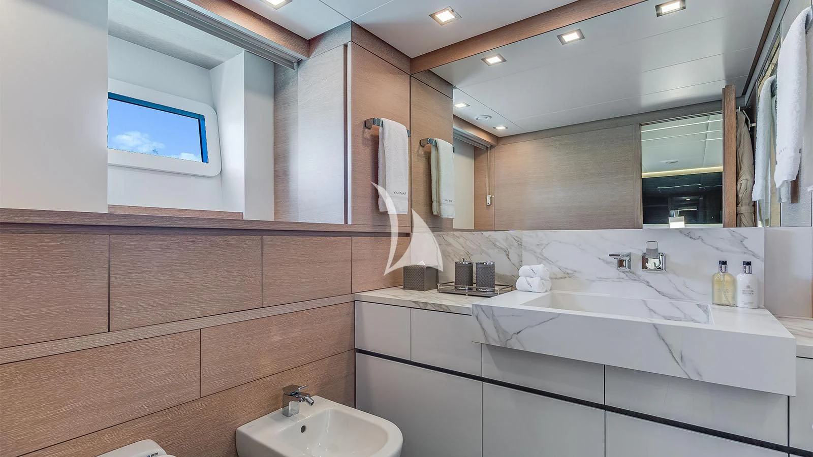 a bathroom with a large mirror aboard BON VIVANT Yacht for Sale