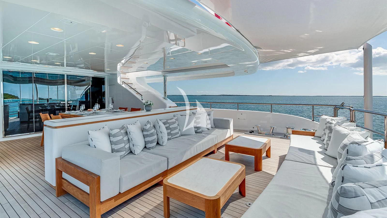 a room with a bed and a table on a boat aboard BON VIVANT Yacht for Sale