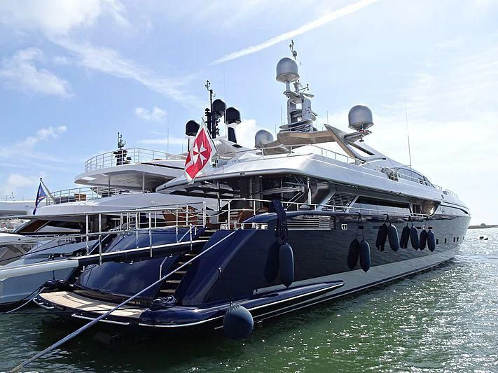 a large boat with a red and white sign on it aboard BON VIVANT Yacht for Sale