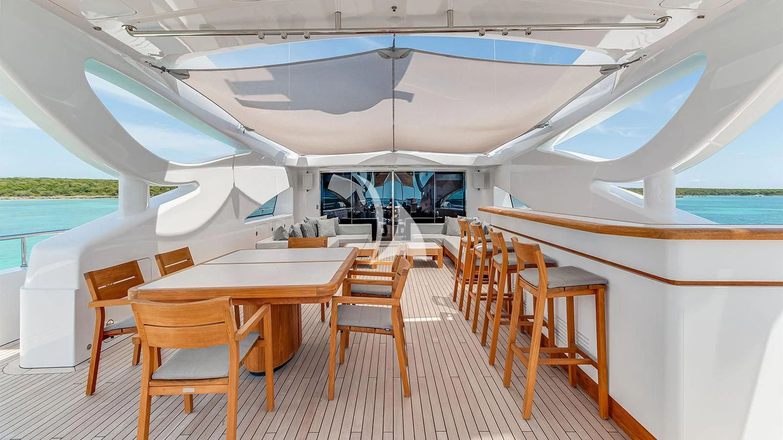 a boat with tables and chairs aboard BON VIVANT Yacht for Sale
