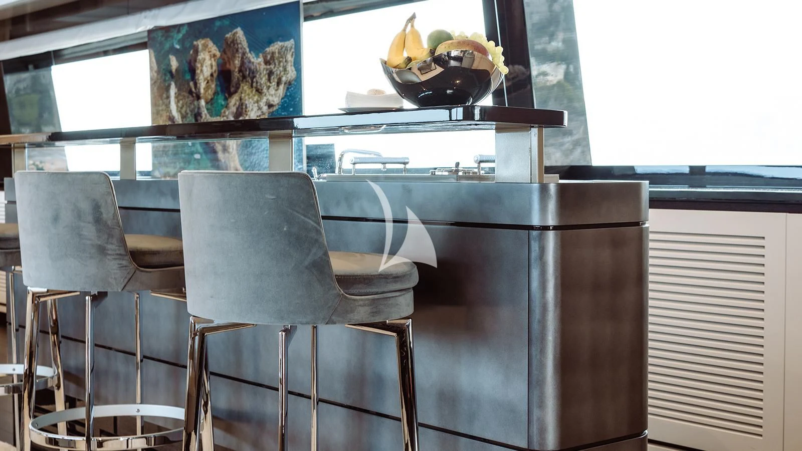 a table and chairs in a room aboard BON VIVANT Yacht for Sale