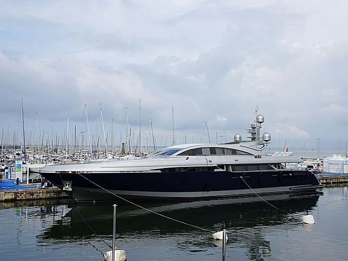 a boat docked at a pier aboard BON VIVANT Yacht for Sale