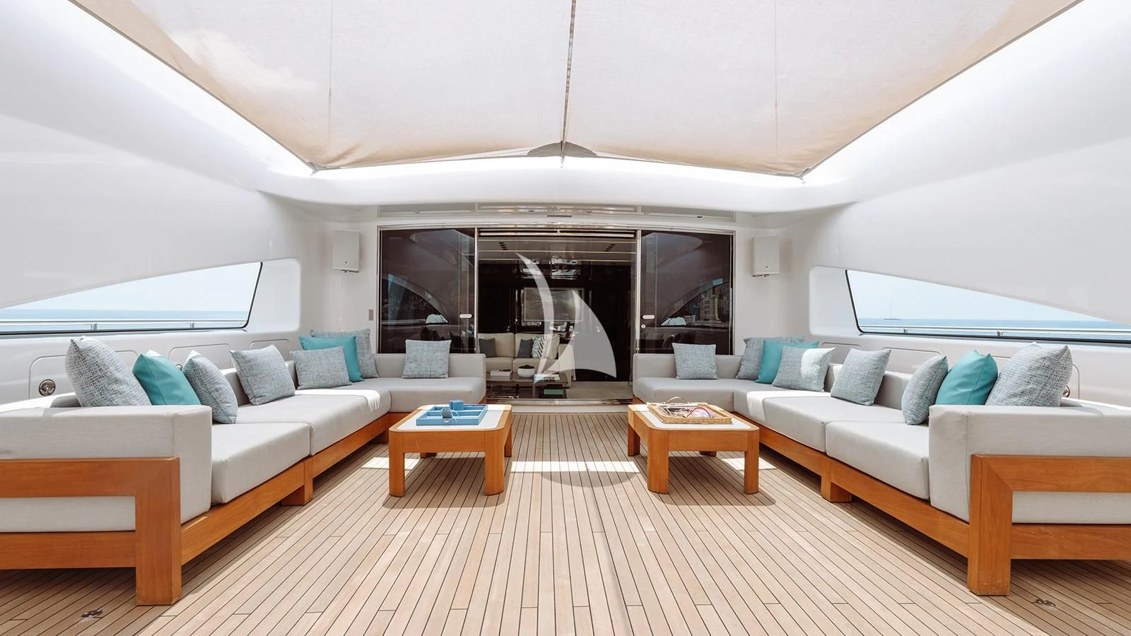 a living room with a couch and a table aboard BON VIVANT Yacht for Sale