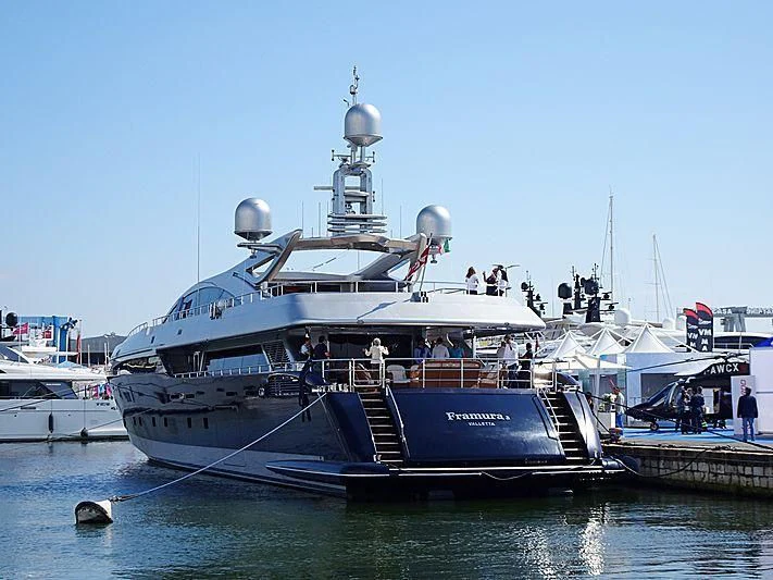 a large ship docked at a pier aboard BON VIVANT Yacht for Sale