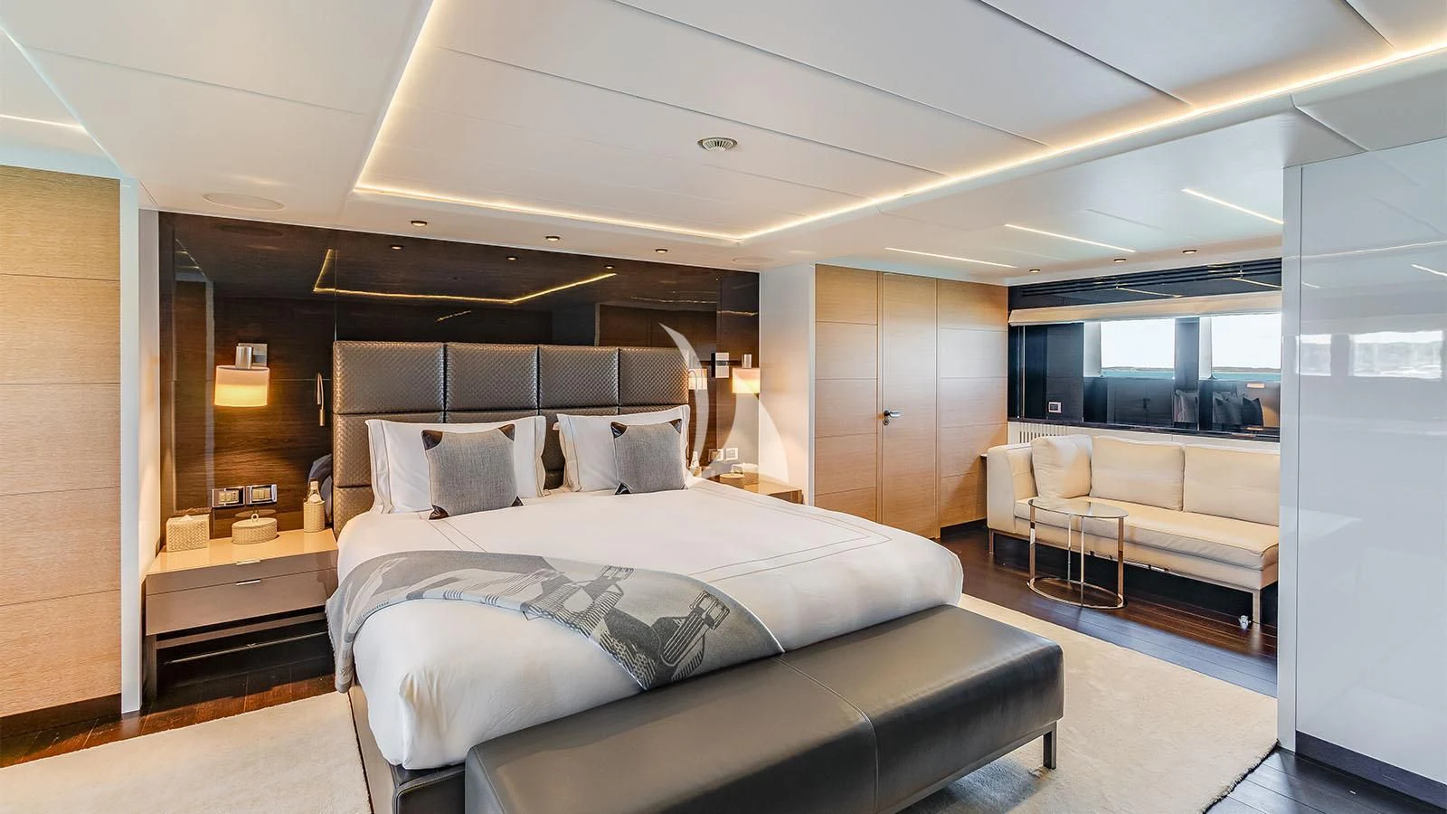 a bedroom with a bed and a couch aboard BON VIVANT Yacht for Sale