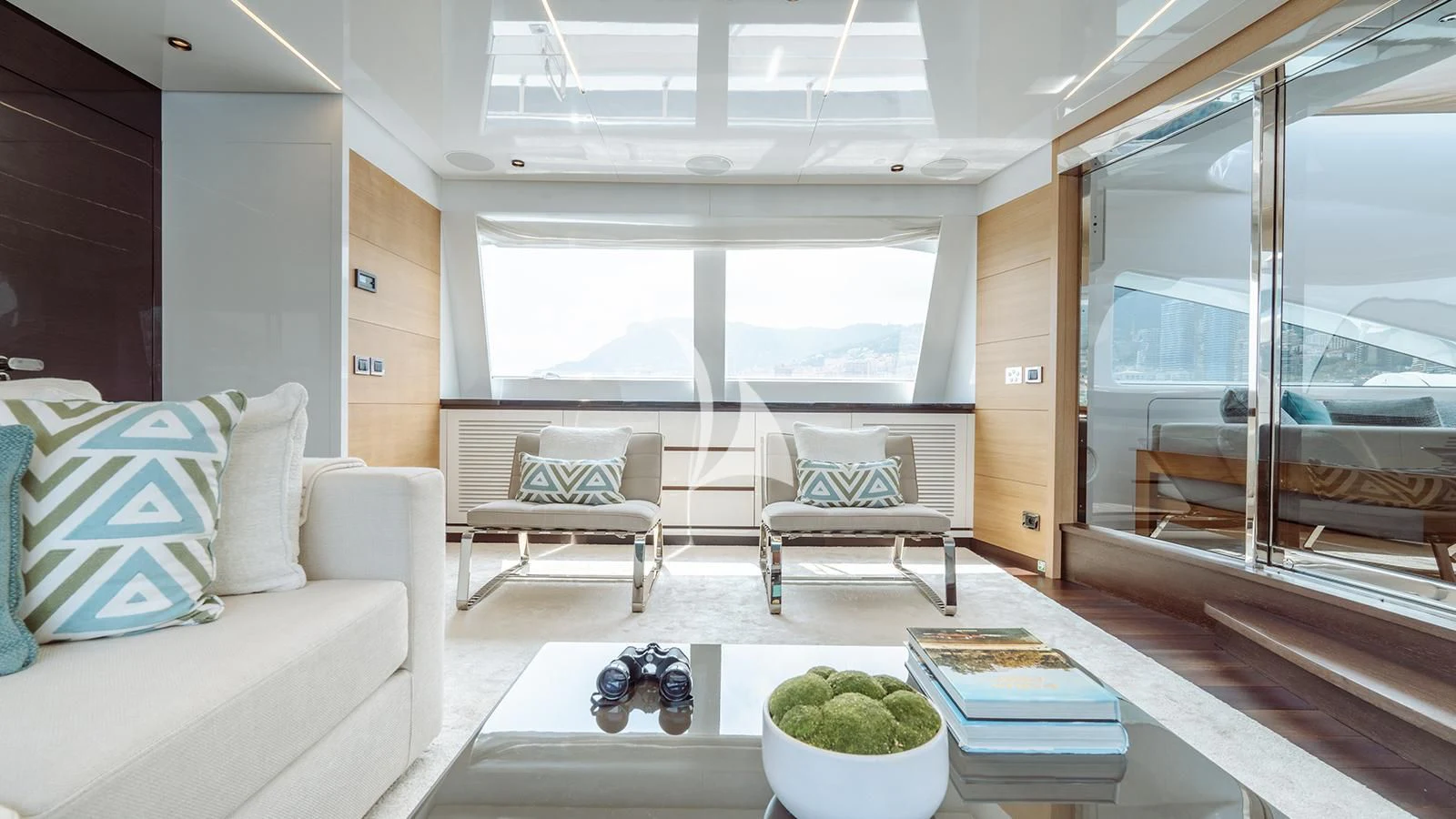 a living room with a large window aboard BON VIVANT Yacht for Sale