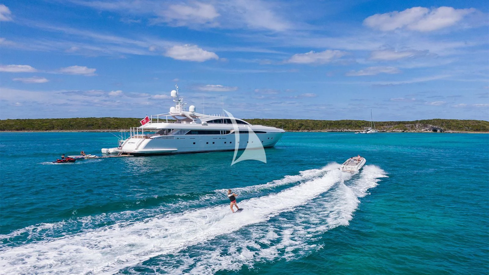 a person surfing in the sea aboard BON VIVANT Yacht for Sale