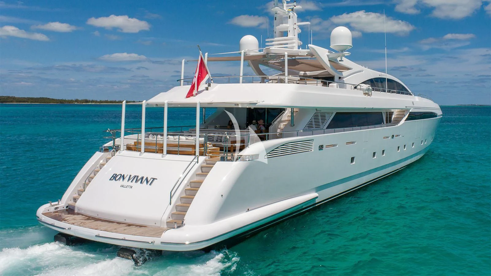 a white boat on the water aboard BON VIVANT Yacht for Sale