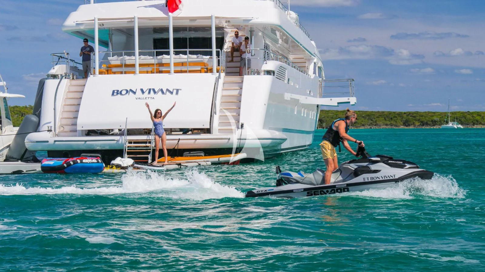 a man on a jet ski aboard BON VIVANT Yacht for Sale