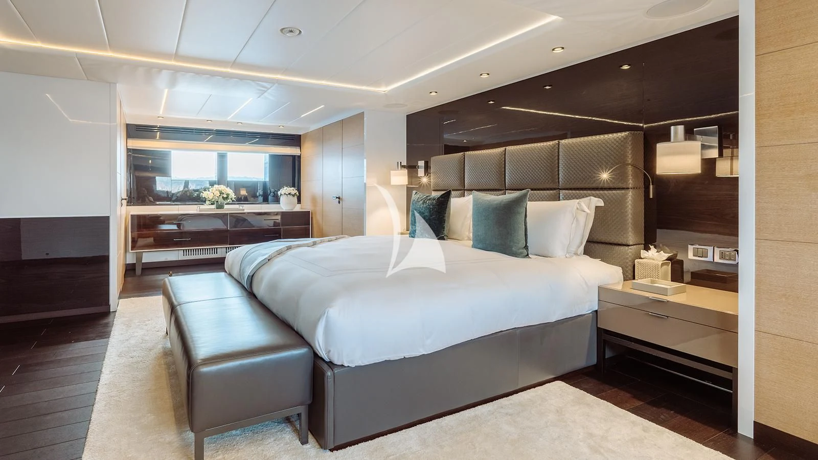 a large bed in a room aboard BON VIVANT Yacht for Sale