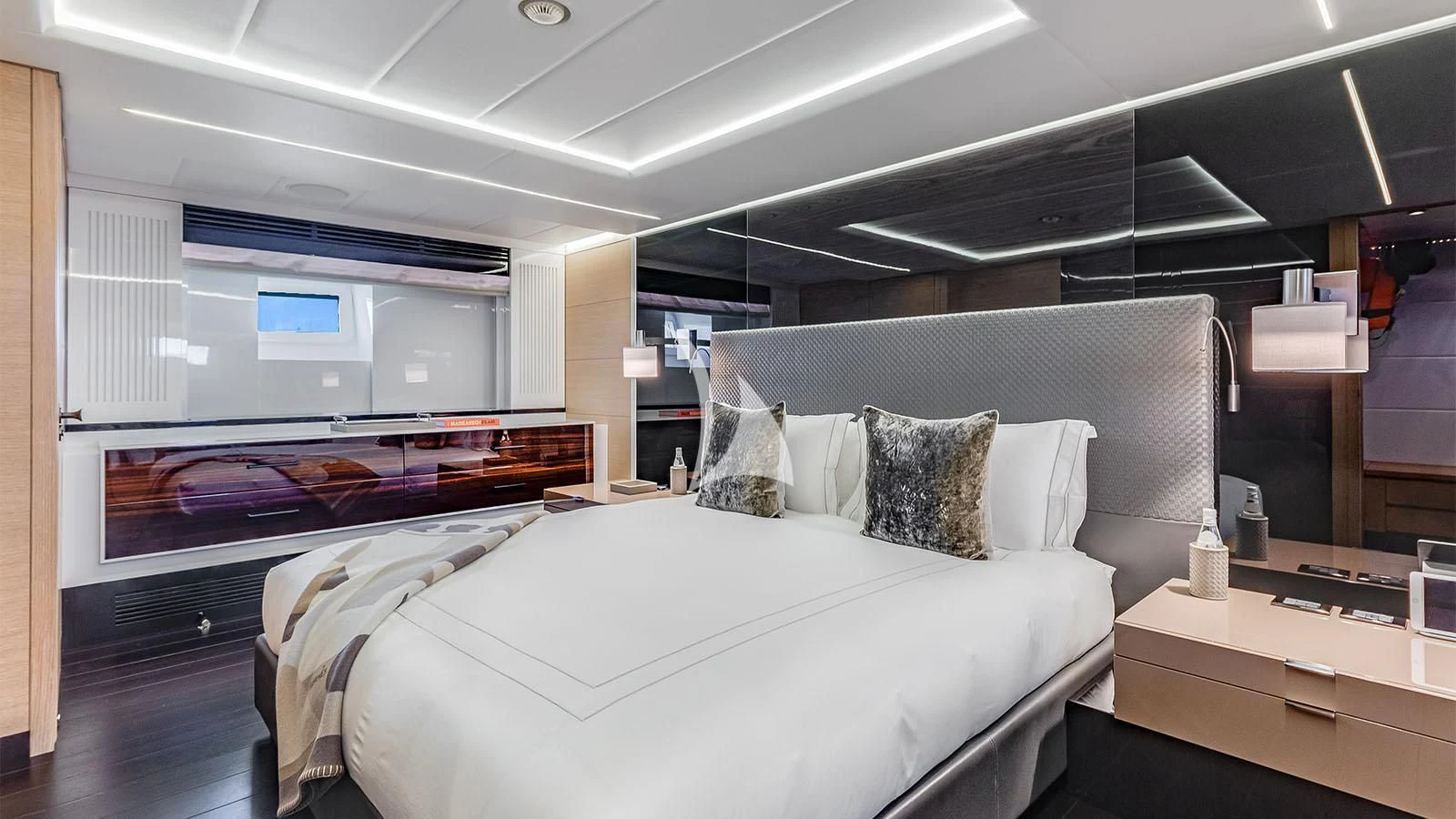 a room with a bed and a desk aboard BON VIVANT Yacht for Sale