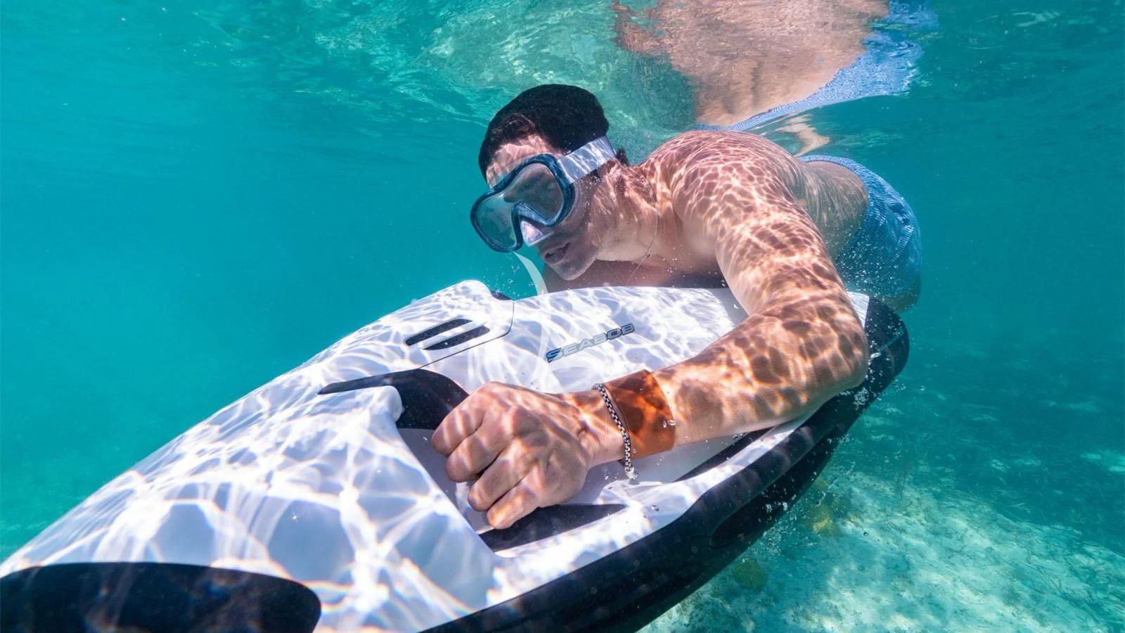 a man holding a fish aboard BON VIVANT Yacht for Sale