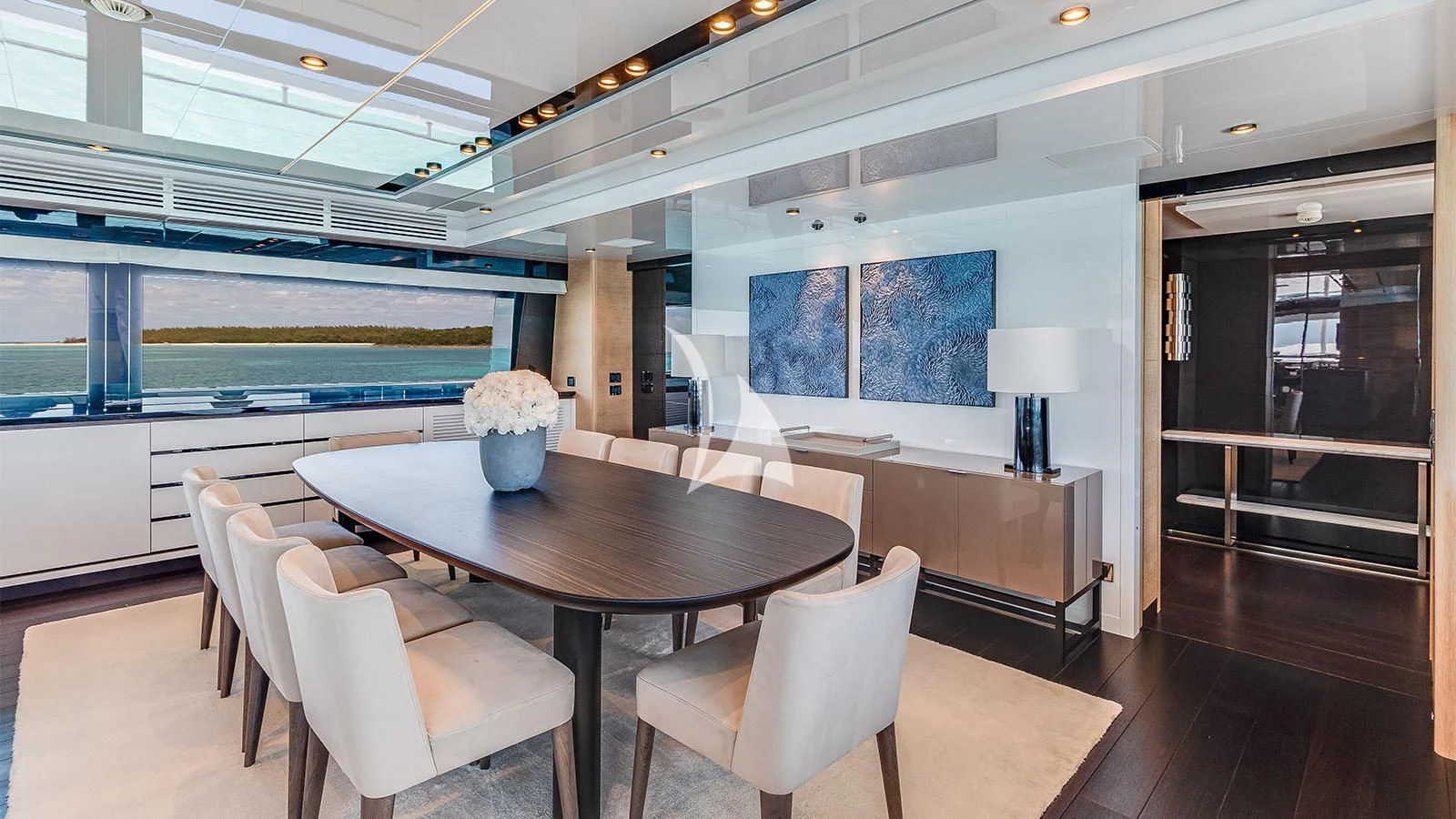 a room with a table and chairs aboard BON VIVANT Yacht for Sale