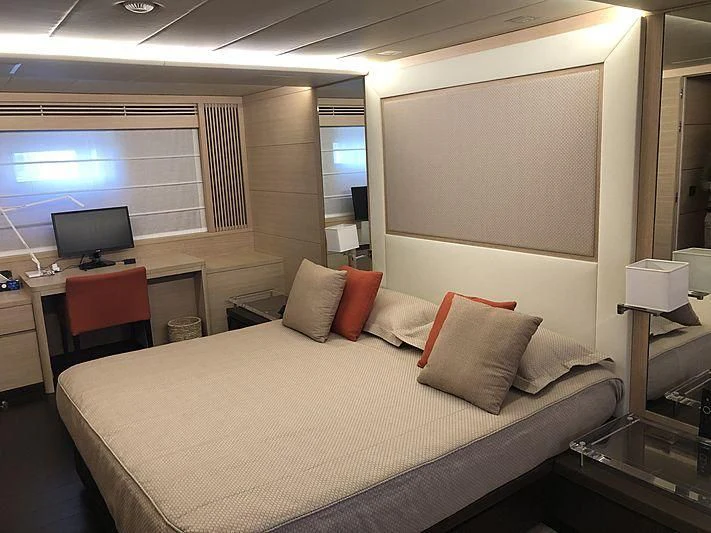 a hotel room with a bed and a tv aboard BON VIVANT Yacht for Sale