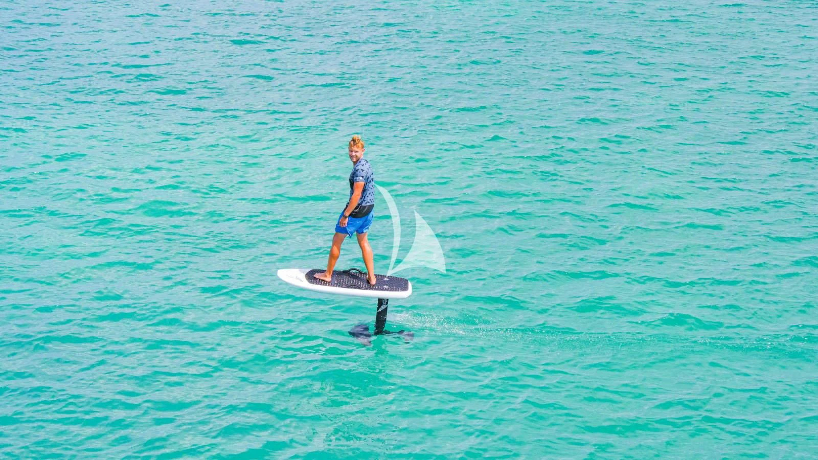 a person on a surfboard aboard BON VIVANT Yacht for Sale