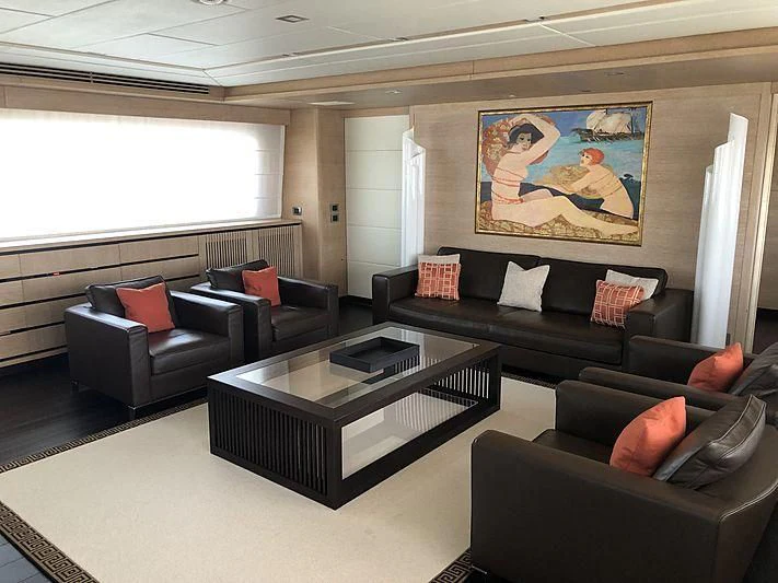 a living room with a couch and a coffee table aboard BON VIVANT Yacht for Sale