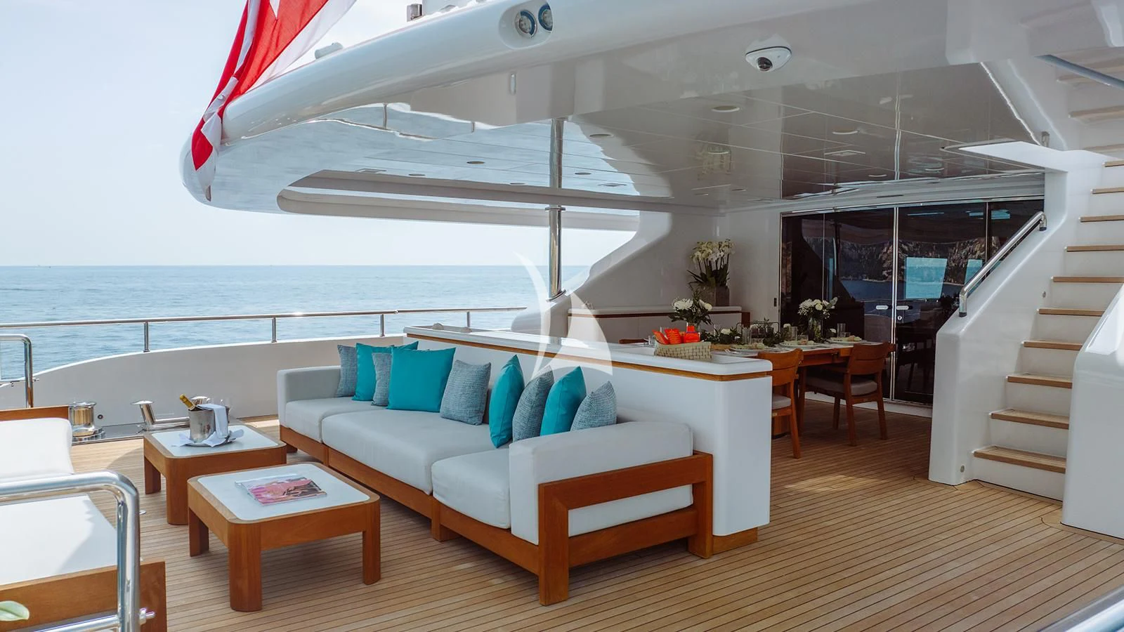 a room with a couch and a table and a large window aboard BON VIVANT Yacht for Sale