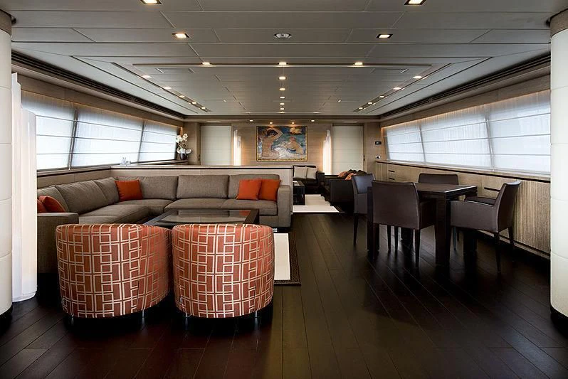 a living room with a couch and a table aboard BON VIVANT Yacht for Sale