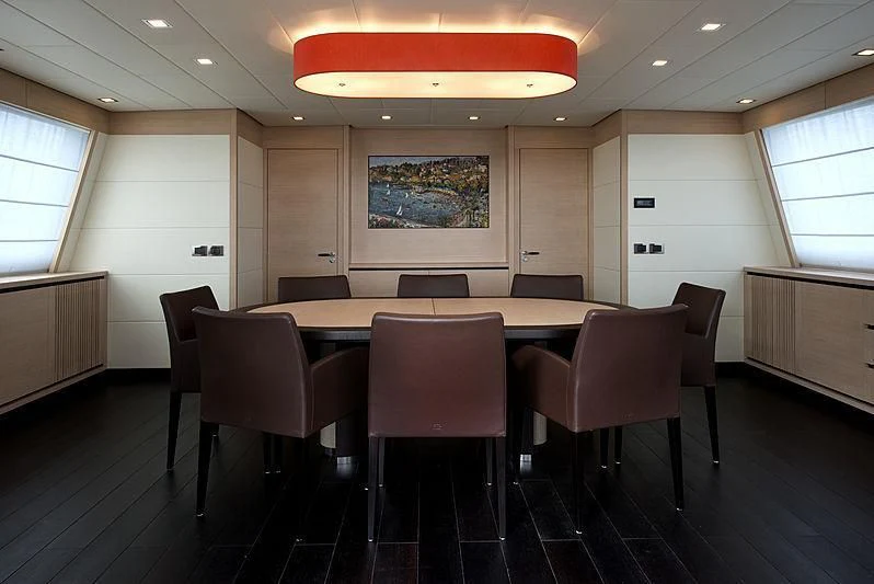 a room with tables and chairs aboard BON VIVANT Yacht for Sale