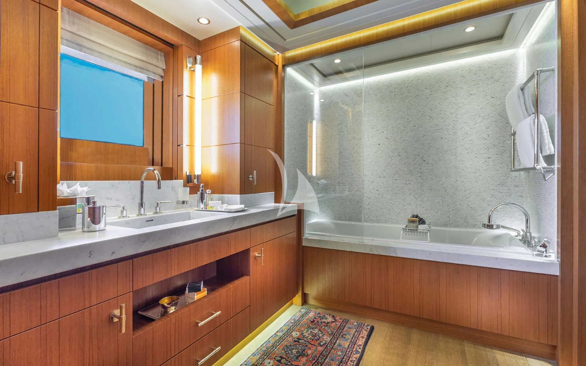 a bathroom with a sink and a bathtub aboard MAN OF STEEL Yacht for Charter
