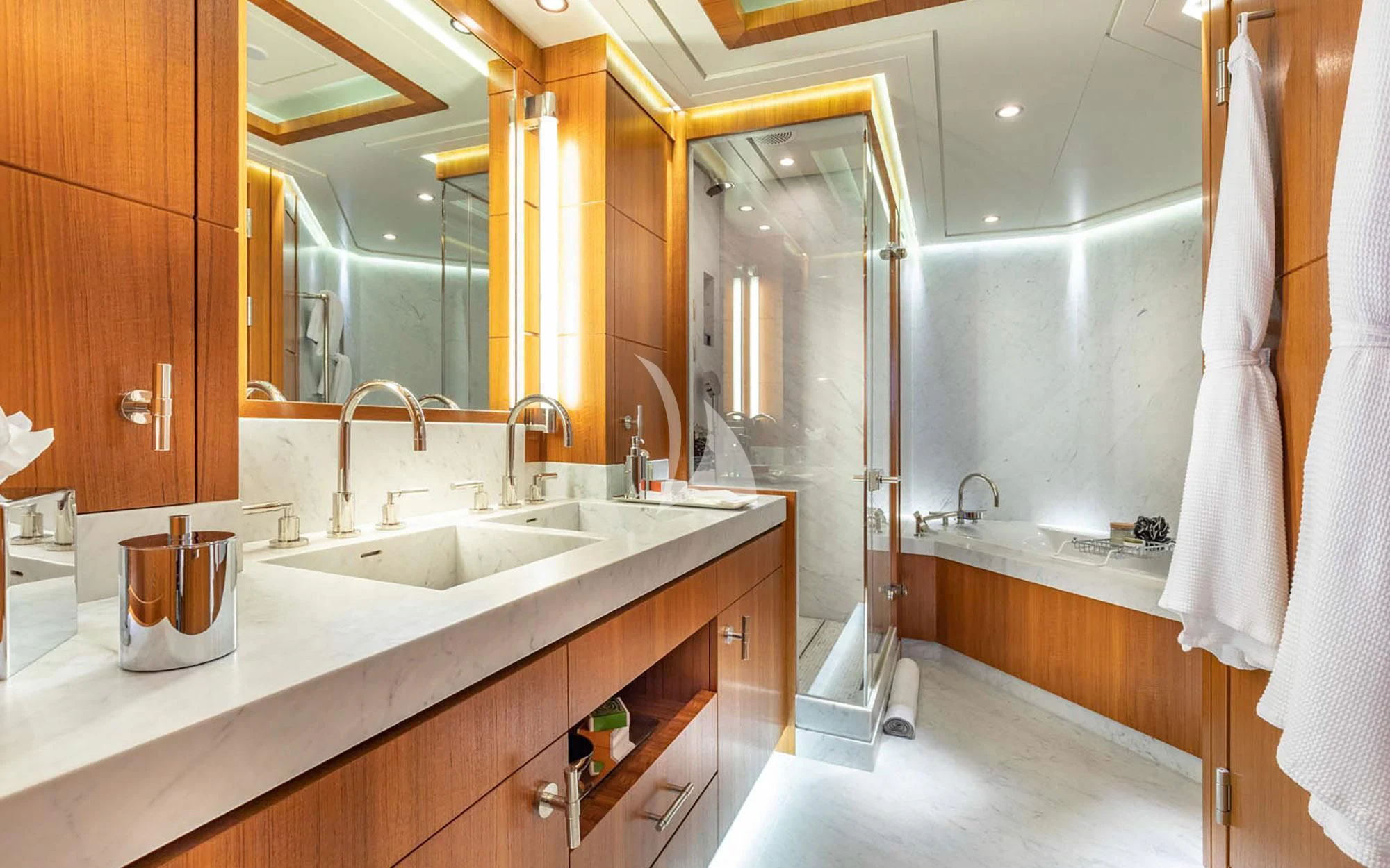 a bathroom with a sink and a mirror aboard MAN OF STEEL Yacht for Charter