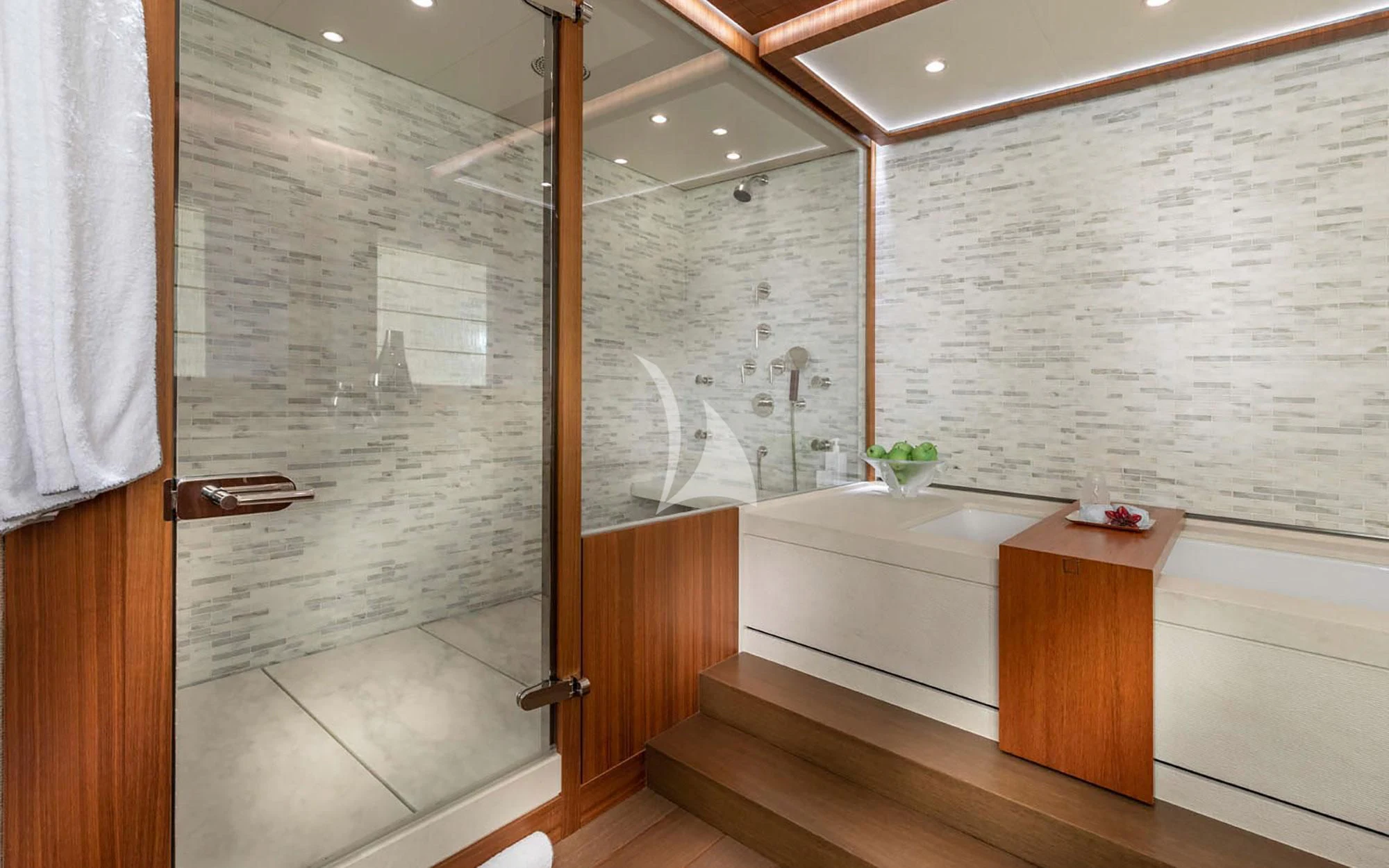 a bathroom with a glass shower aboard MAN OF STEEL Yacht for Charter