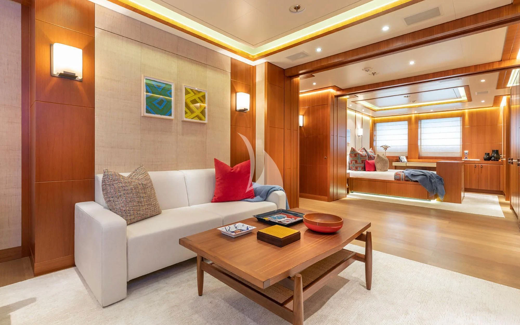 a living room with a couch and a coffee table aboard MAN OF STEEL Yacht for Charter