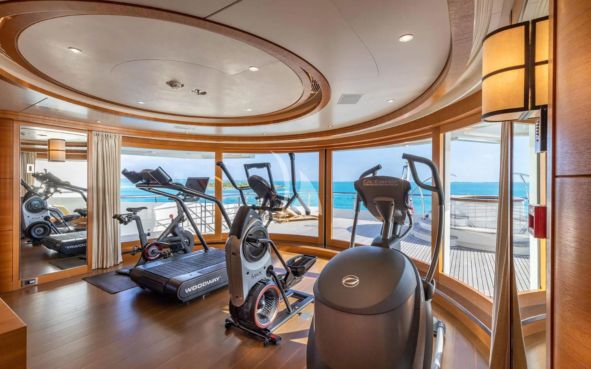 a gym with exercise equipment aboard MAN OF STEEL Yacht for Charter