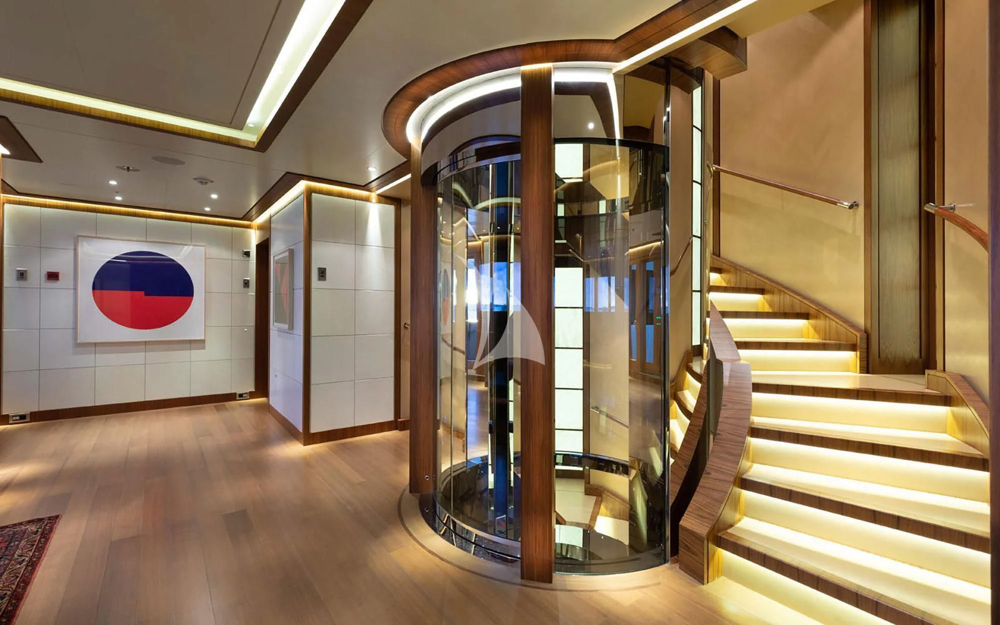 a room with a large glass display case and a red and white sign aboard MAN OF STEEL Yacht for Charter