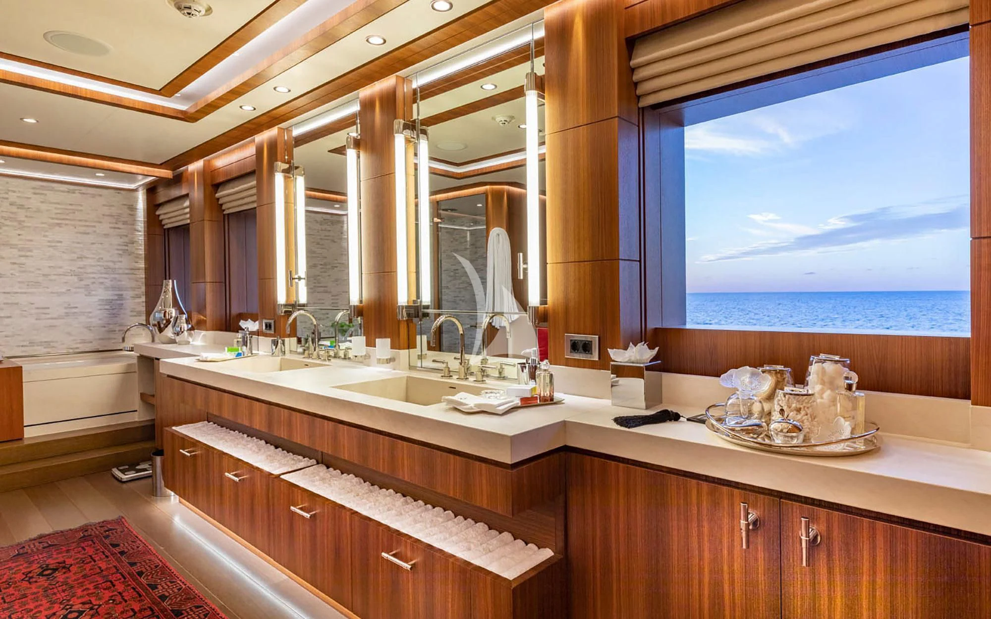 a bathroom with a large window aboard MAN OF STEEL Yacht for Charter