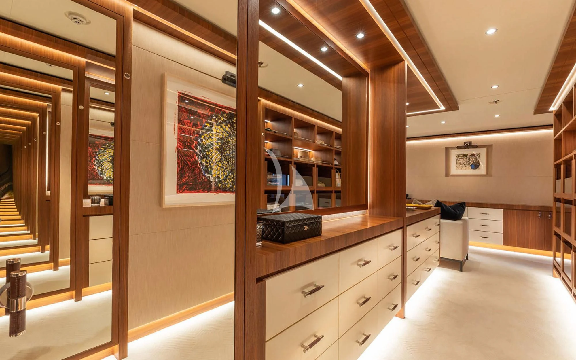 a room with a dresser and a mirror aboard MAN OF STEEL Yacht for Charter
