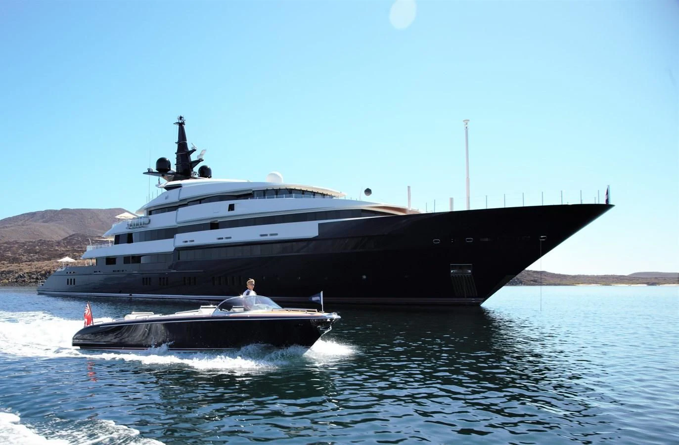 a large ship on the water aboard MAN OF STEEL Yacht for Charter