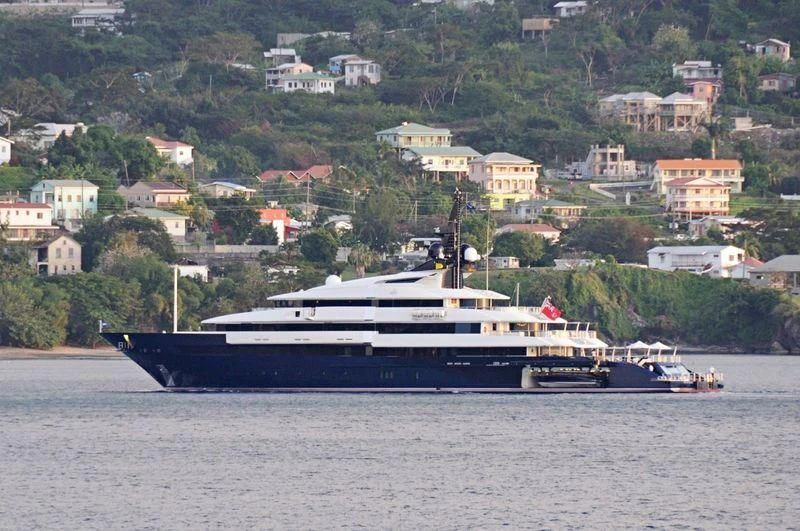 a large boat on the water aboard MAN OF STEEL Yacht for Charter
