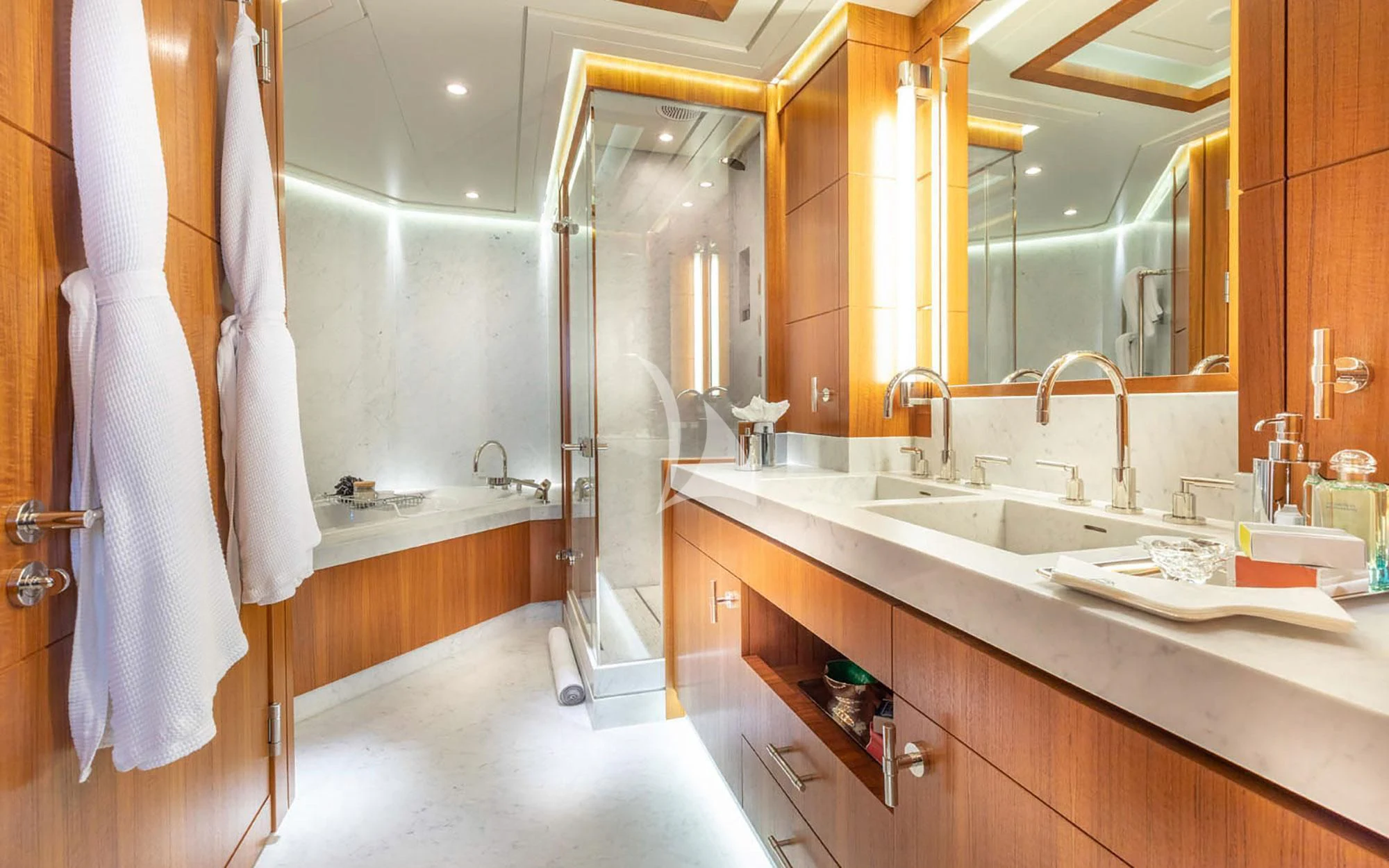 a bathroom with a large mirror aboard MAN OF STEEL Yacht for Charter